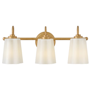 Honey Medium Three Light Vanity in Distressed Brass