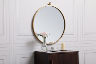 Metal frame round mirror with decorative hook 21 inch in Brass